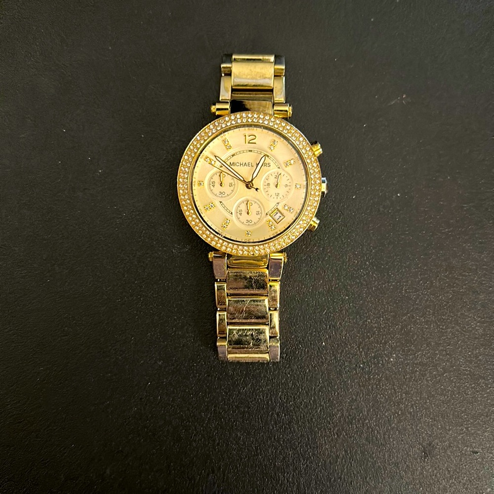 Michael Kors ladies watch, used, color is gold (varnished from wear)